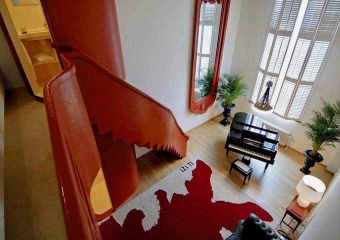 The Mezzanine suite features a huge bed and a piano.