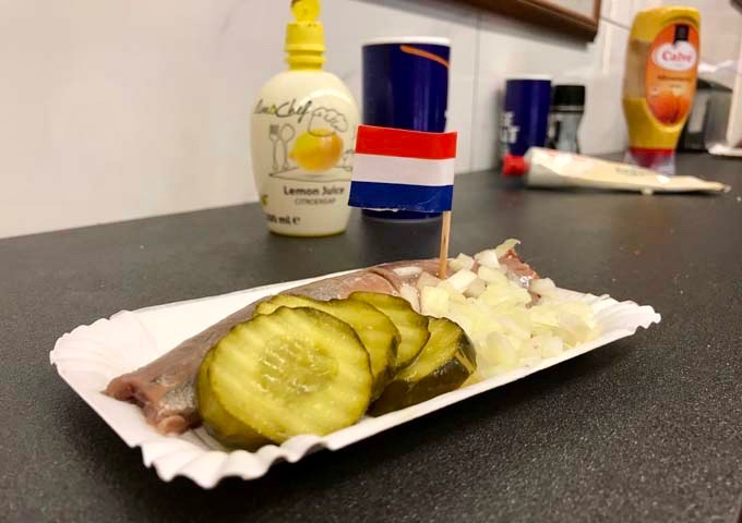 Raw herring with pickles is a very popular snack.
