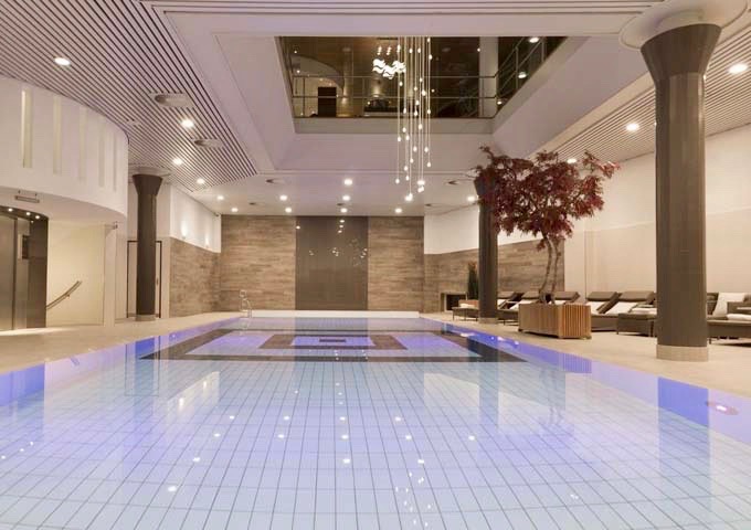 The indoor swimming pool is next to a Japanese-style garden.