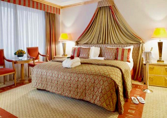 The Royal Suite bedroom has an oversized bed, and premium drinks in the minibar.