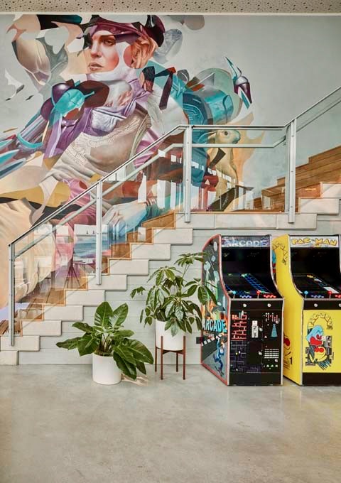 The lobby features vintage arcade games for guests.
