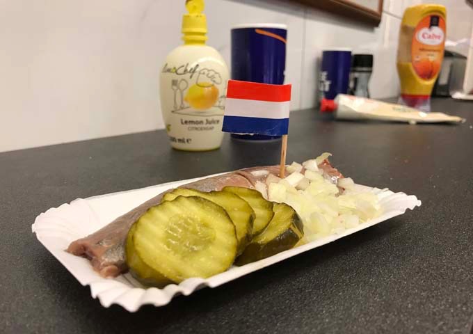 Raw herring with pickles is a very popular Dutch snack.