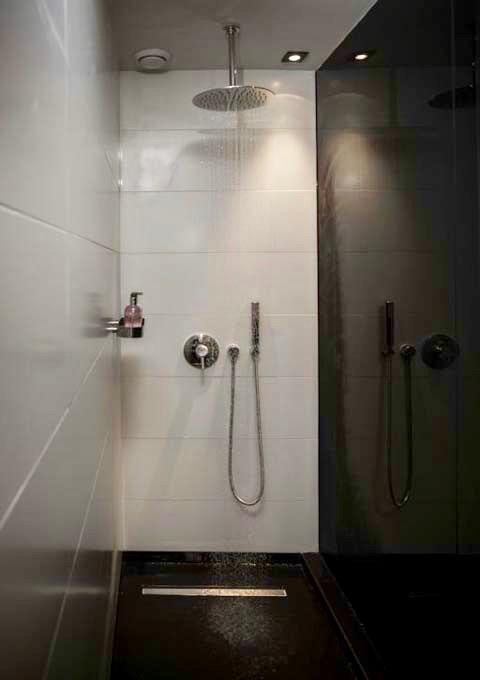 The bathroom of Sir Residence suite has a large rain shower.