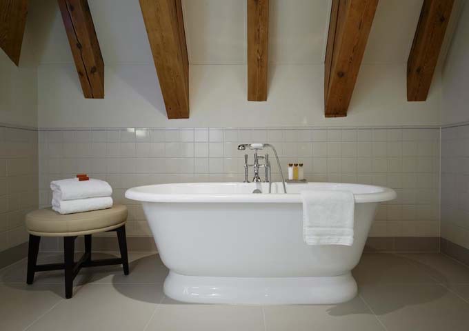 Many bathrooms feature free-standing tubs.