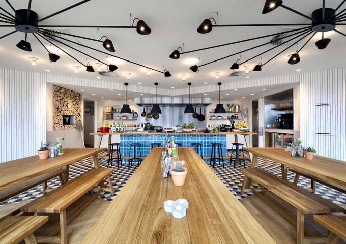 The hotel features a communal dining space to encourage socializing between guests.