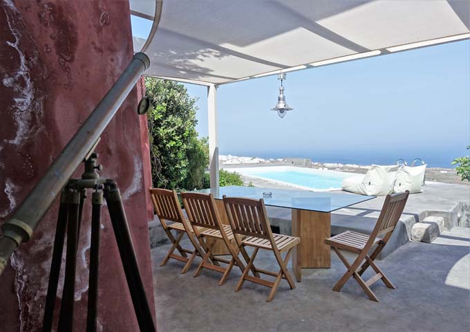 The villa features a private pool, al fresco dining area, and an antique telescope.