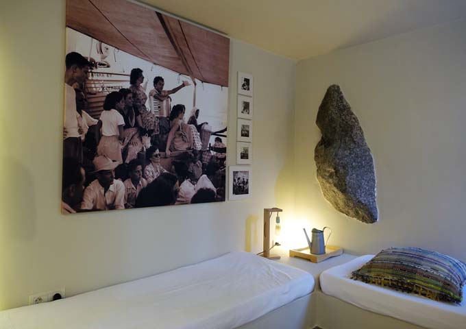 The living room features a natural lava rock in the wall.