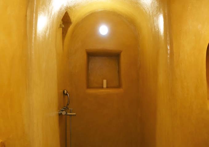 The traditional bathroom has an open shower.