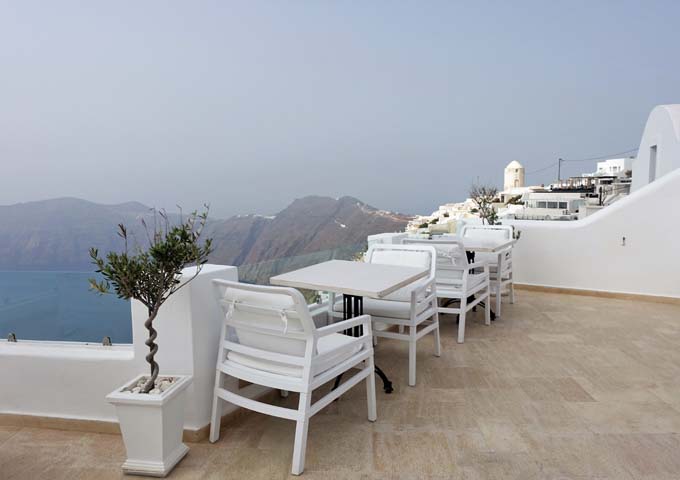 The dining terrace offers panoramic views of the caldera and Oia-Fira Hiking Trail.