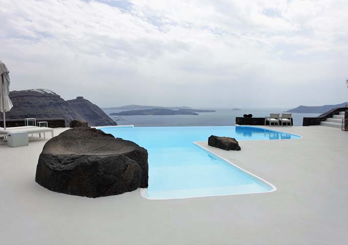 The infinity pool offers views of both volcanoes, Imerovigli, Thirassia and Aspronisi.