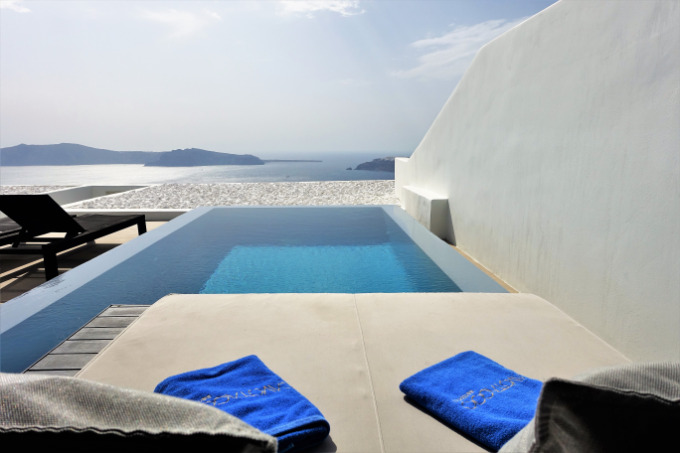 The large terrace has an infinity pool, sun loungers, dining area and a daybed.