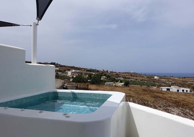 The private jacuzzis in Supreme Suites offer distant views of the Aegean Sea.