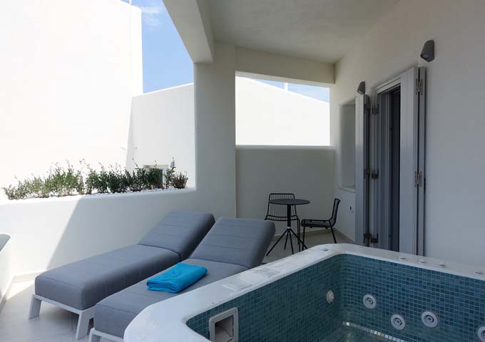 The private balcony features a jacuzzi, sun loungers and al fresco dining area.