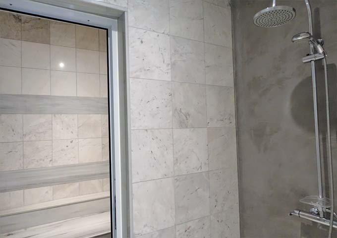 The shower area leads to a steam room.