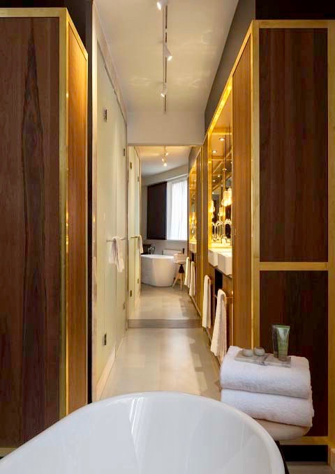 The Deluxe Suite features a palatial bathroom with free-standing tub.