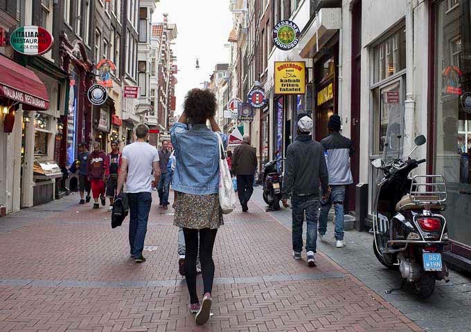 Niuewendijk shopping street runs between Niewezijds Voorburgwal and Damrak thoroughfares.