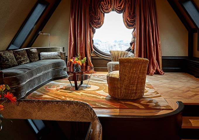 The Penthouse Suite features a giant porthole window overlooking the Medieval Center.