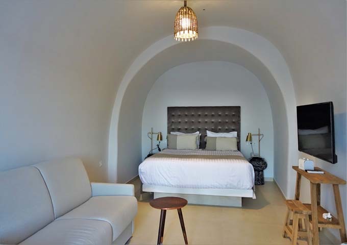 The villa's master bedroom has an arched ceiling.