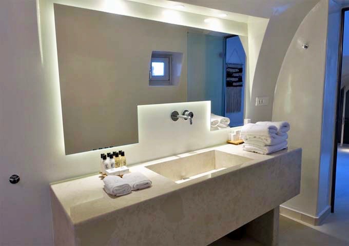 The master bathroom has a luxurious vanity.