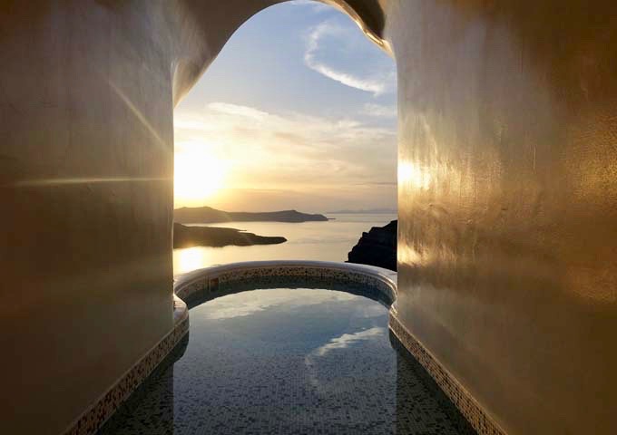 The master bathroom leads to a cave-style jacuzzi with spectacular views.