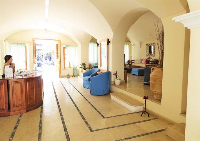 The bright lobby has vaulted ceilings and archways.