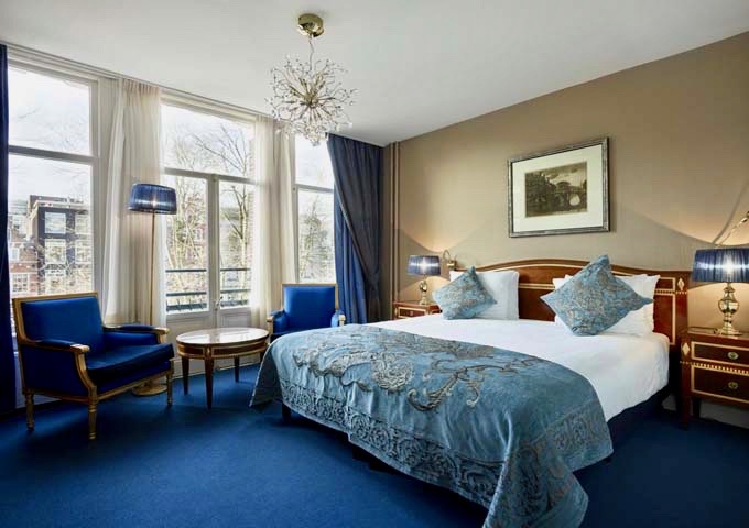 Spacious Deluxe rooms offer views of the Herengracht canal.