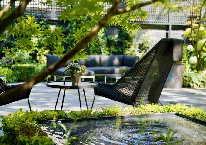 The tranquil garden has plenty of seating.