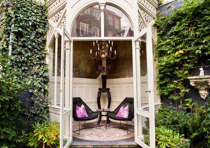 The cozy Summer House in the garden is a good place to relax in.