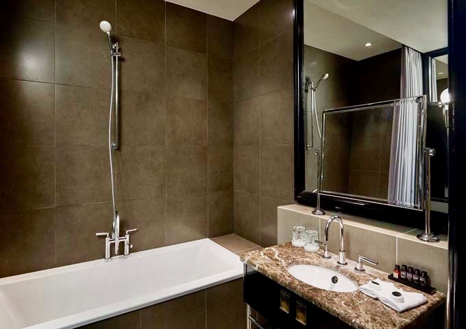 Some Superior rooms feature tubs in addition to rain showers.