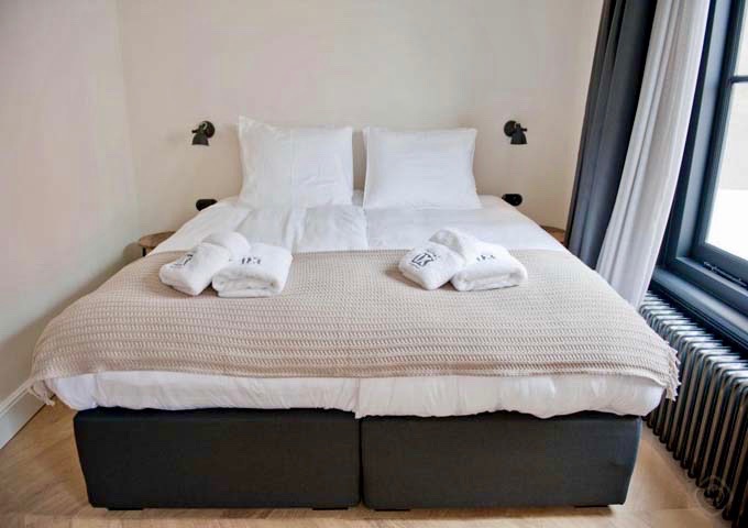 Berenstraat suite's bedroom is cozy and offers noisy street views.