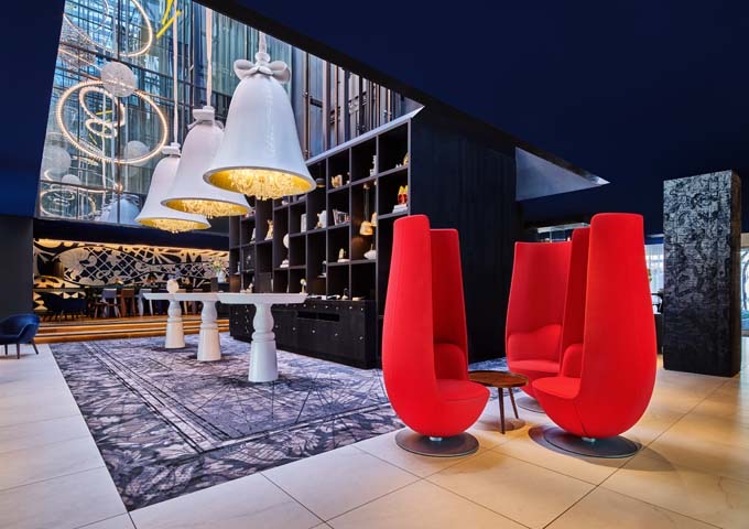 The lobby features tulip-shaped chairs.