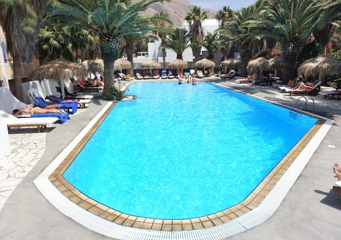 Palm trees and umbrellas offer plenty of shade at the main pool.