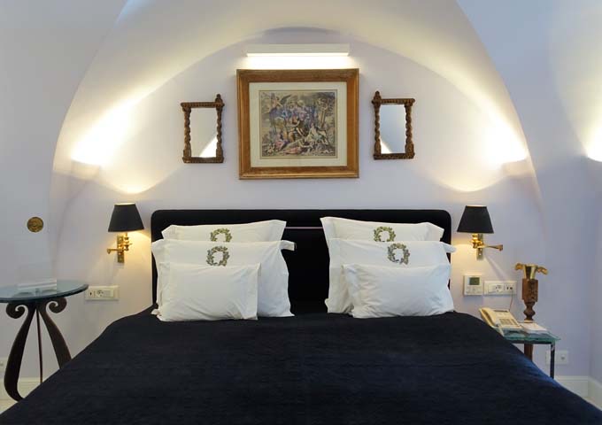The comfortable bedroom has a king bed and is tastefully-decorated.