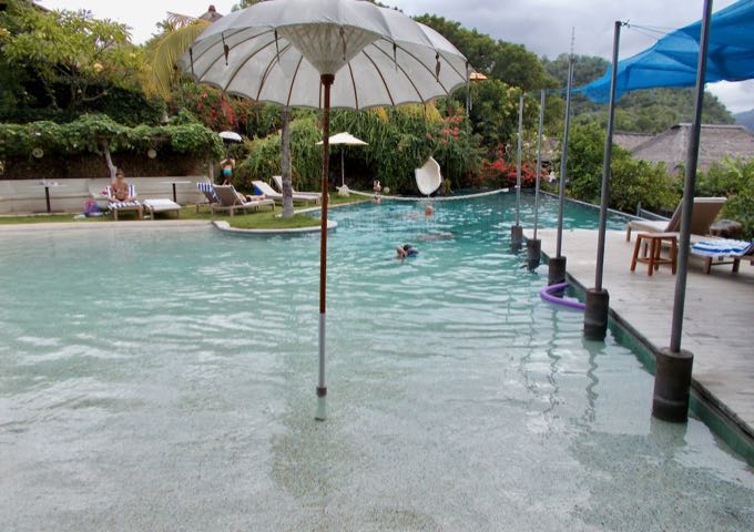The large pool is inviting and has a waterslide.
