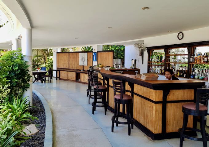 The curved terrace leads up to a bar.