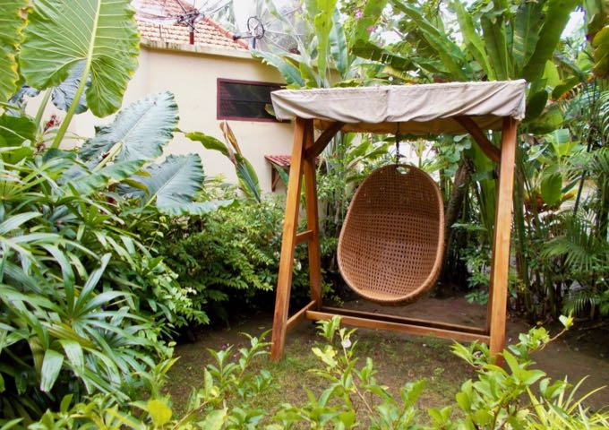 Chair swings are scattered around the resort gardens.