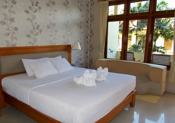 The spacious rooms have a simple decor and feature towel origami.