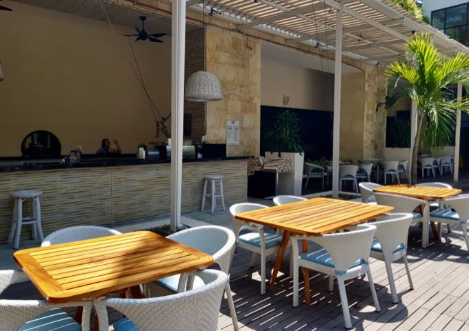 The Splash Bistro has poolside seating on a wooden deck.