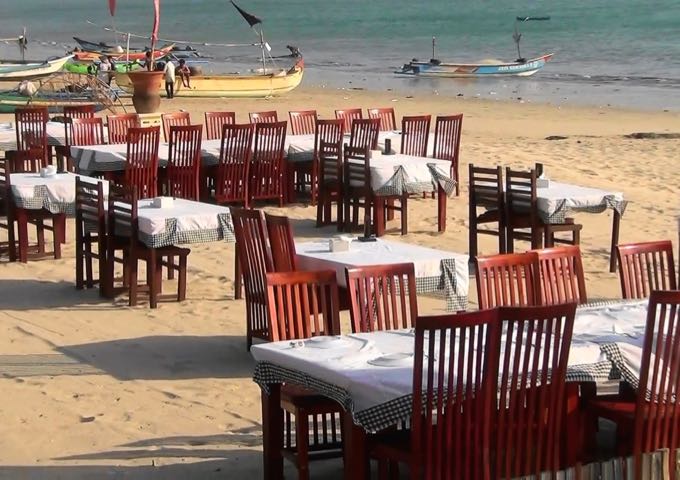 Muaya Beach cafes offer sunset dinners on the sand.