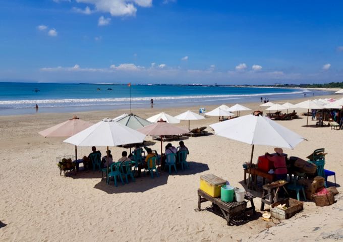 Nearby, beach cafes serve seafood and other dishes on the sand.