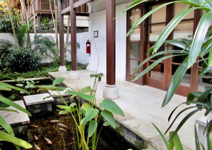 The villas have private gardens with fish-filled ponds.