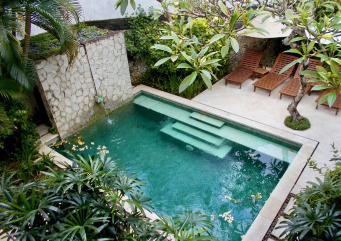 Each villa features a shady terrace with a pool.