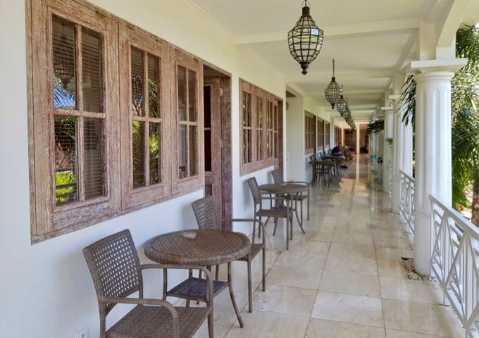 Rooms open to a common balcony overlooking the main pool.