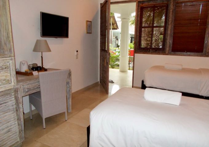 The room decor is contemporary, and includes wooden furniture.