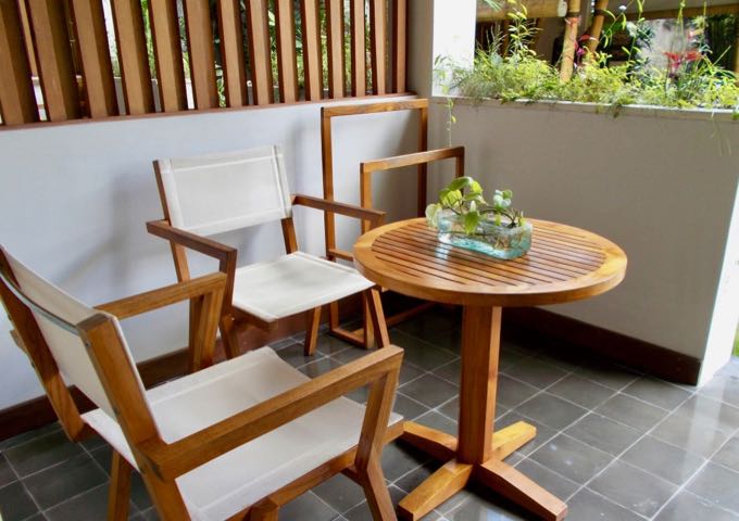 The patios feature a sofa, table, and chairs.