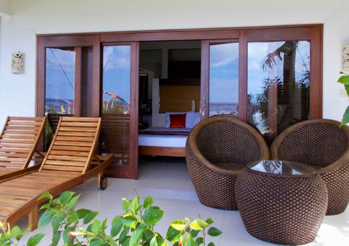 The villa veranda/balcony are well-furnished.