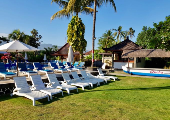 The lawn between the pool and the beach has plenty of lounge chairs.