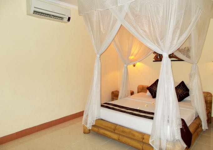 The spacious rooms have Balinese-style furniture.