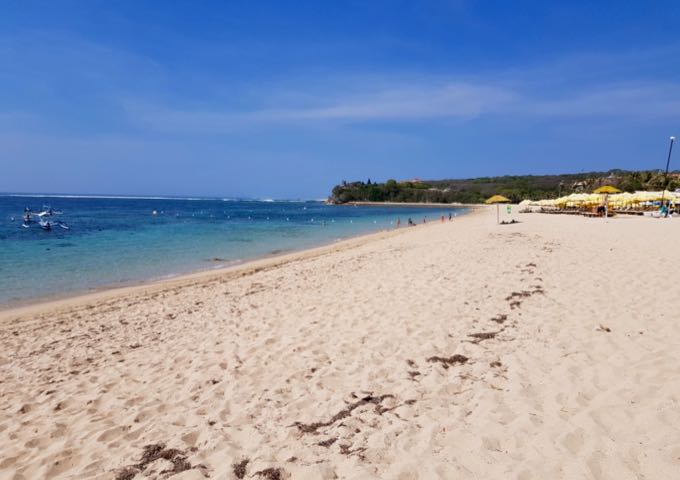 The beach in front of The Mulia resort is open to the public.