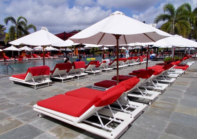 The pools are surrounded by several lounge chairs.